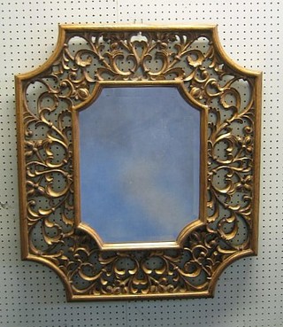 A Georgian style shaped bevelled plate wall mirror contained in a gilt pierced frame