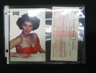 A colour portrait photograph of Ava Gardner together with a Lloyds Bank Cheque from the Park Lane Branch, 84 Park Lane, London, dated 22nd March 1978, Pay Ciro Pearls Ltd