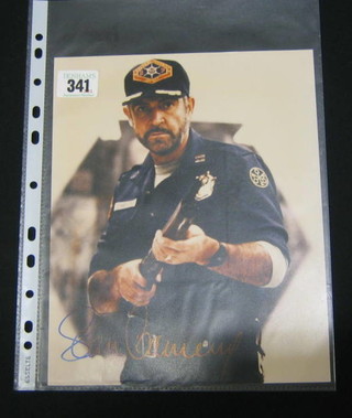 A  colour photograph of Sean Connery wearing an American Police Uniform, signed Sean Connery