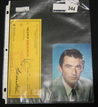 A  colour portrait photograph of Gregory Peck together with a United California Bank cheque for the Trial of The Catonsville 9 Ltd Partnership Pay the Sum of $342.81 Dixon R Wimpey dated 4 November 1971