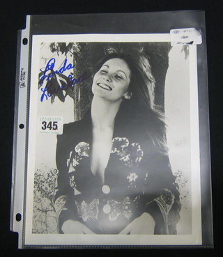 A black and white portrait photograph of Linda Lovelace, inscribed Linda Lovelace