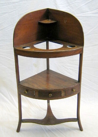 A Georgian mahogany corner wash stand with three bowl receptical and undertier fitted 2 drawers, 20"