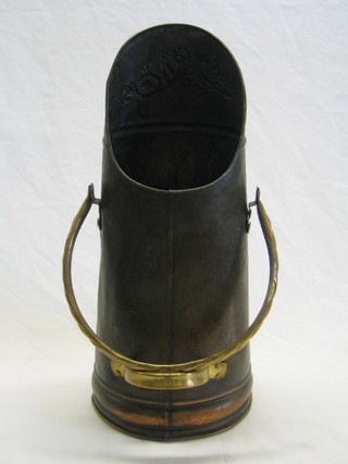 A Continental embossed metal coal hod with brass swing handle