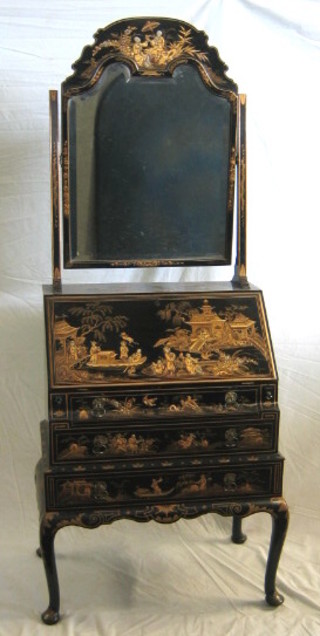 A 1930's black lacquered chinoiserie style bureau, the upper section with bevel plate shaped dressing mirror, the fall front revealing a well fitted interior above 3 long drawers, raised on cabriole supports 28"