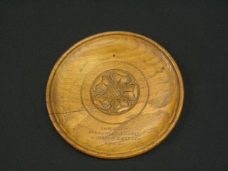 A circular carved oak dish marked St George's Chapel Windsor 8"