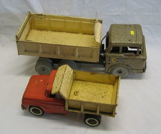 A Tonka tip up truck 13" and a Power House tip up truck