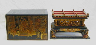 An Oriental lacquered and carved hardwood model of a temple contained in a lacquered box 15"
