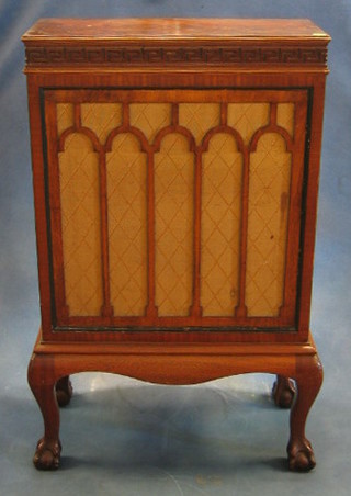 A Pelestion model no. 44 radio speaker contained in a figured mahogany case on cabriole supports 24"