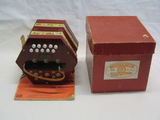 A German Democratic Republic octagonal shaped concertina Galitto with 20 buttons