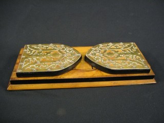 A pair of Victorian walnutwood and brass banded expanding book ends