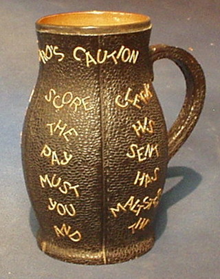 A Victorian Doulton & Slater patterned leather effect Tavern jug "The Landlord's Caution" the base marked Doulton & Slater 2728 with silver rim 9" (slight chip to base and handle)