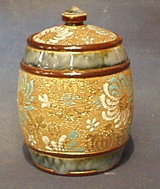 A circular Doulton salt glazed biscuit barrel and cover, the base marked Doulton Slater  5"