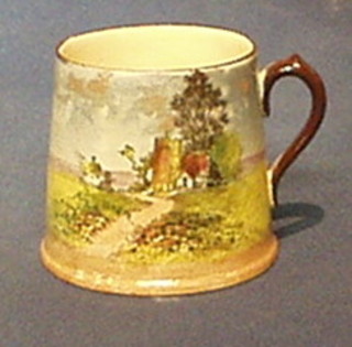 A circular Doulton seriesware mug decorated Church and Landscape with base marked Royal Doulton D4390 3", the base with 1" chip