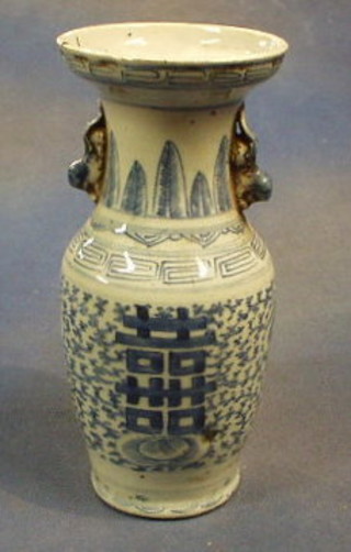 A 19th Century blue and white twin handled baluster shaped vase with character decoration to the front (slight crack) 10"