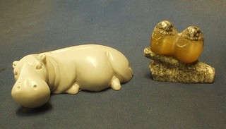 A stone figure of a reclining Hippopotamus 4" and 2, 2 colour stone figures of birds