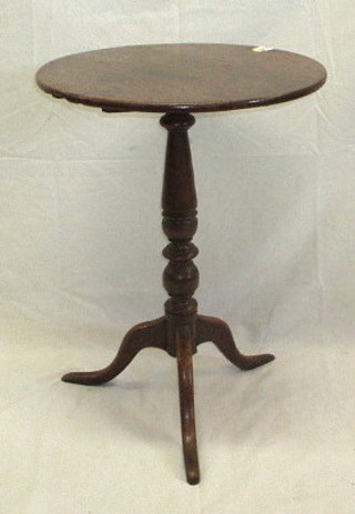 A 19th Century circular oak snap top tea table, raised on turned and tripod supports 20"