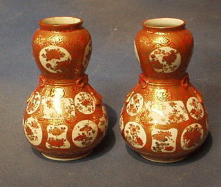 A pair of Japanese Kutani double gourd shaped vaes with floral decoration 6" (1 f and r)