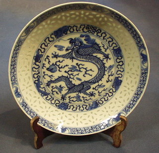 A pair of 19th Century Oriental porcelain plates decorated dragons, the reverse with 6 character mark 10"