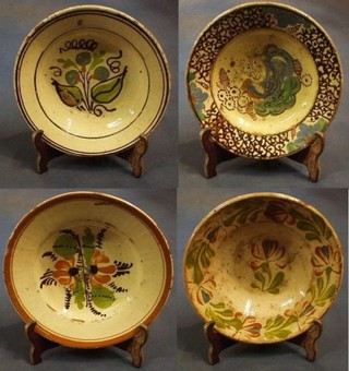 A 19th Century Continental Earthen ware bowl with painted floral decoration, a 19th Century Continental terracotta bowl painted a bird 8", and 2 Earthenware bowls with floral decoration