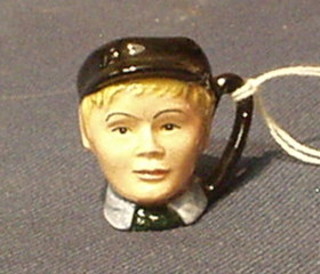 A Royal Doulton tiny character jug "Oliver Twist D6677