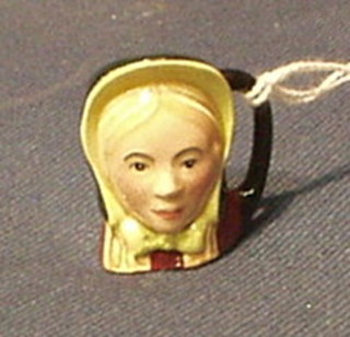 A Royal Doulton tiny character jug "Little Nell" D6681