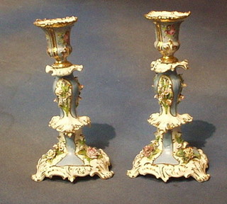 A pair of 19th Century Continental porcelain candlesticks with floral encrusted decoration 10" (f)