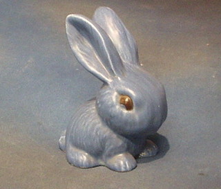 A Sylvac style seated figure of a blue glazed rabbit, base impressed 107 9"