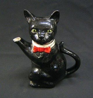 A Tony Wood black pottery teapot in the form of a seated cat 9"