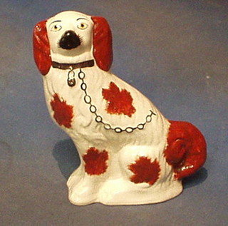 A Staffordshire figure of a seated Spaniel 9"