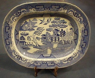 A blue and white Willow pattern pottery meat plate 18"