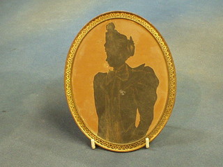 A Victorian silhouette of a lady contained in a gilt frame 7" oval
