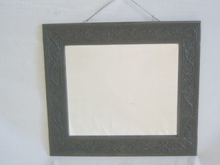 A Victorian bevelled plate wall mirror contained in a carved oak frame 29"