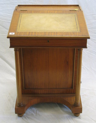A 19th Century satinwood Davenport desk with three-quarter gallery inset tooled leather writing surface, the pedestal fitted inkwell drawer and 4 long drawers, raised on turned columns 21"