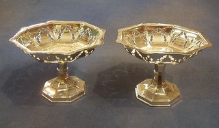 A pair of octagonal pierced silver plated bon bon dishes, raised on waisted bases, 6"