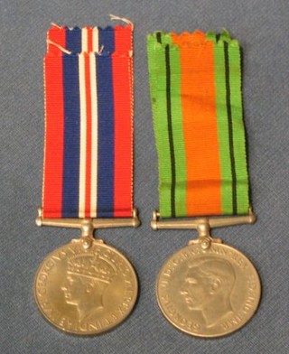 A pair - British War medal and Defence medal with cardboard carton
