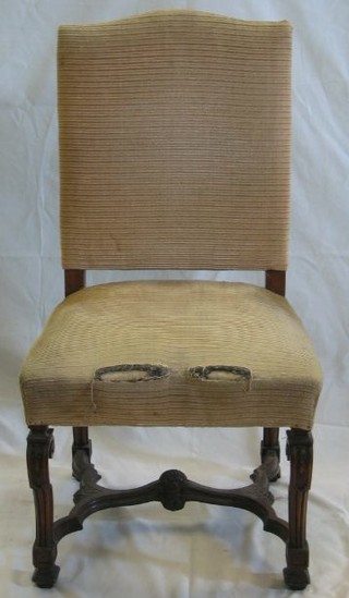 An Italian carved walnutwood standard chair, raised on carved reeded supports with H framed stretcher