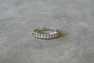 A lady's 18ct white gold dress ring set 11 baguette cut diamonds