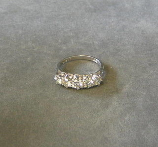 A lady's 18ct white gold dress ring set 5 diamonds and 6 diamonds to the shoulders (approx 1.24 ct)