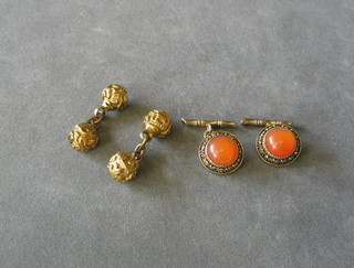 A pair of Oriental cufflinks set cabouchon cut stones and 2 gilt ball cufflinks