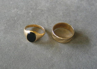 A 9ct gold wedding band and a 9ct gold signet ring
