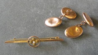 A pair of oval 9ct gold cufflinks and a gold bar brooch (3)