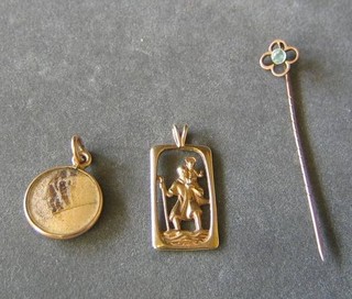 A 9ct gold St Christopher, a gilt metal locket and a gilt metal stick pin (3)