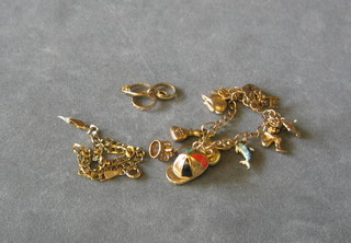 A 9ct gold charm bracelet hung 9 charms with gilt padlock clasp and 3 gilt charms and a modern gold bracelet