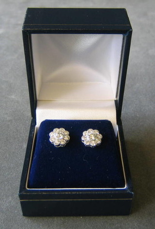 A pair of lady's diamond cluster earrings, set 9 diamonds (approx 0.90 ct)