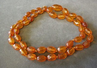 A string of amber coloured beads