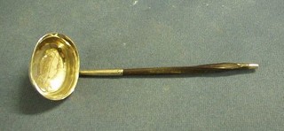 A George III oval silver sauce ladle monogrammed M (marks rubbed)