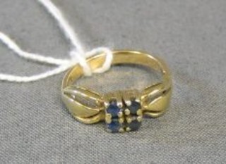 A gold dress ring set 4 sapphires