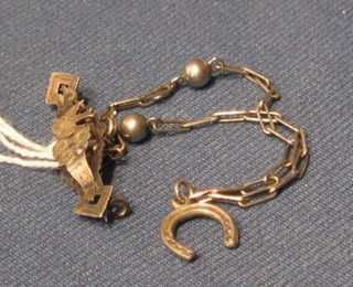 A silver bar brooch and a silver bracelet
