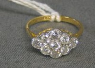 A lady's gold dress ring set 9 diamonds