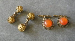 A pair of Oriental cufflinks set cabouchon cut stones and 2 gilt ball cufflinks